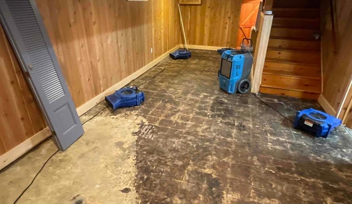 wood house water damage restroration blue equipment