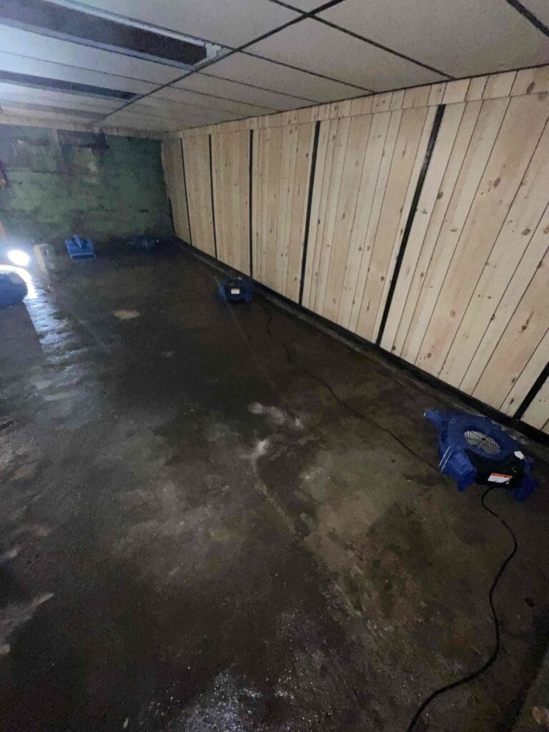 Air movers drying a basement after a sewage backup in Coldwater, Michigan