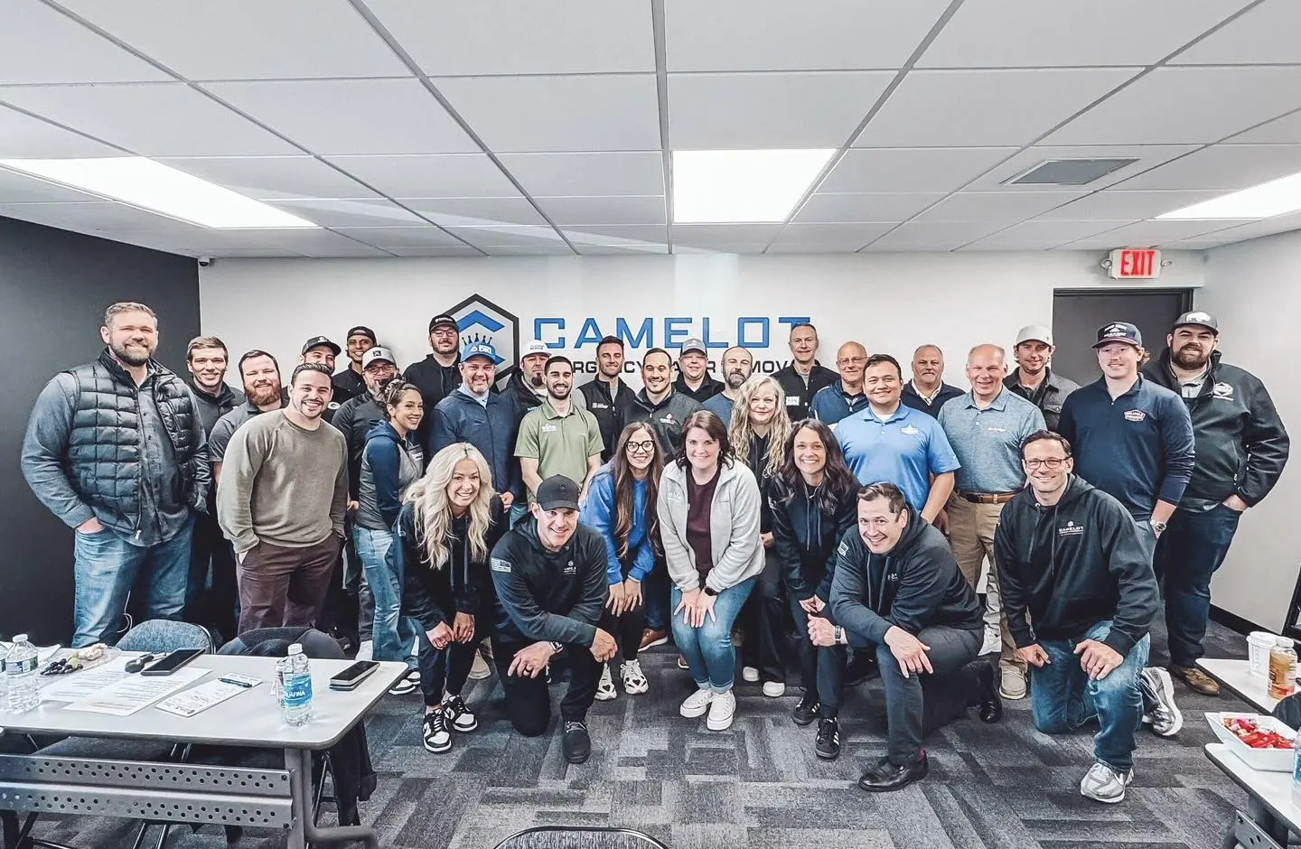 Camelot Emergency Water Removal team gathered in the office, shown for office building water removal